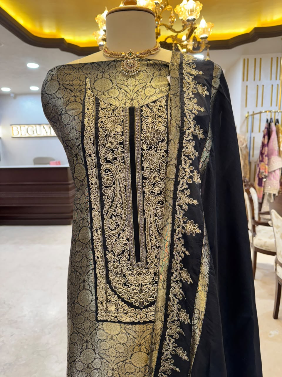 Regal ensemble is crafted in a luxurious deep black Kim Khaab