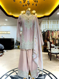 Elegant ensemble is crafted in a soft Blush Pink Tissue Silk