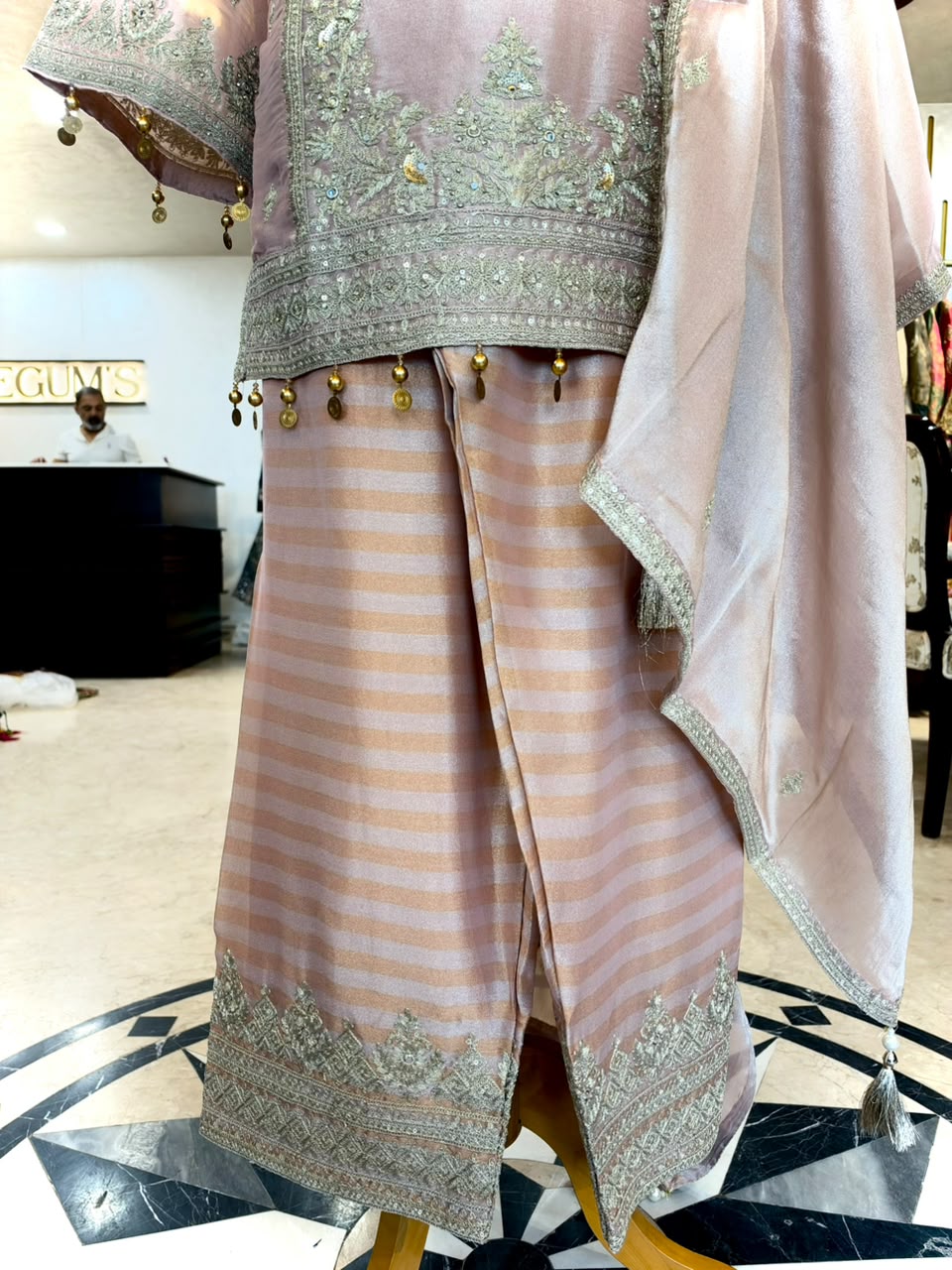 Elegant ensemble is crafted in a soft Blush Pink Tissue Silk